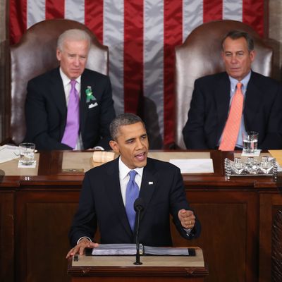 WASHINGTON, DC - FEBRUARY 12: Flanked by U.S. Vice President Joe Biden (L) and Speaker of the House John Boehner (R), U.S. President Barack Obama (C) delivers his State of the Union speech before a joint session of Congress at the U.S. Capitol February 12, 2013 in Washington, DC. Facing a divided Congress, Obama concentrated his speech on new initiatives designed to stimulate the U.S. economy and said, 