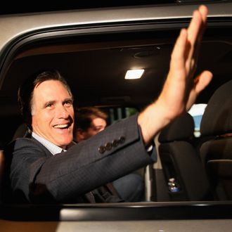 THE VILLAGES, FL - JANUARY 30: Republican presidential candidate, former Massachusetts Gov. Mitt Romney waves as he rides away in his vehicle after a grassroots rally with supporters at Lake Sumter Landing on January 30, 2012 in The Villages, Florida. Romney is campaigning across the state ahead of the January 31 Florida primary. (Photo by Joe Raedle/Getty Images)
