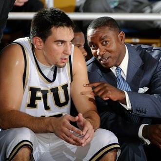 Florida International University Head Coach Isiah Thomas gives instructions to forward Nikola Gacesa (15) during the game against Northwood University in Northwood's 71-61 victory in an exhibition game at U.S. Century Bank Arena, Miami, Florida.