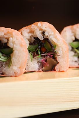 The Pink Monk: Soy paper, seasoned hijiki, konyaku, daikon, avocado, asparagus, shitake, and micro greens. This roll is vegetarian.