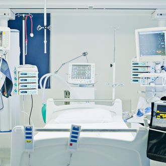 Empty hospital bed in intensive care