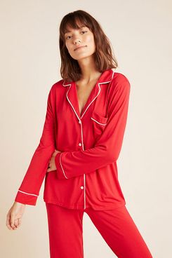 A red longsleeve Eberjey Gisele Long-Sleeved Sleep Set with white piping and buttons, lapels, and a breast pocket. The Strategist - 48 Things on Sale You’ll Actually Want to Buy: From Sunday Riley to Patagonia