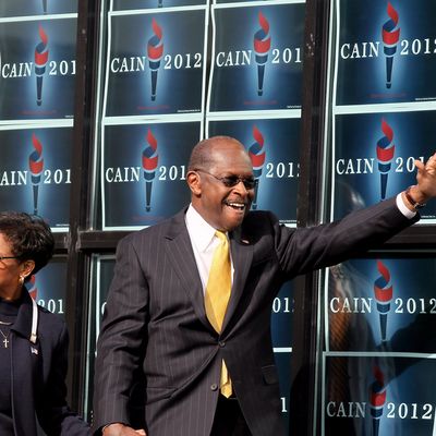 ATLANTA, GA - DECEMBER 03: Republican presidential candidate Herman Cain and his wife Gloria Cain arrives to speak during the scheduled opening of a local campaign headquarters on December 3, 2011 in Atlanta, Georgia. Cain took time to reassess the condition of his campaign 