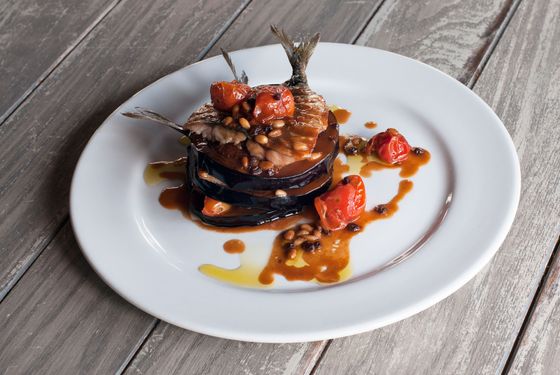 Sardines and eggplant with roasted tomato, pine nuts, currants, and lamb jus.