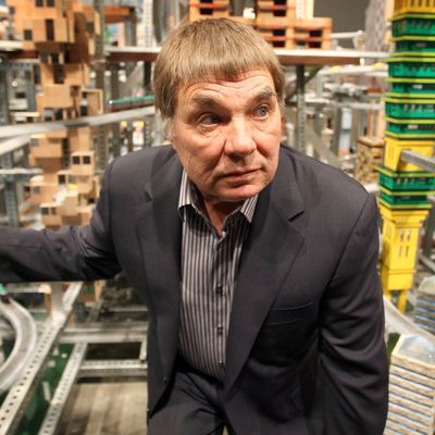 12 Jan 2012, Los Angeles, California, USA --- Chris Burden stands next to his large-scale kinetic sculpture, Metropolis II, during the media preview at the Los Angeles County Museum of Art (LACMA) in Los Angeles, California January 11, 2012. The sculpture, modeled after a fast-paced futuristic city with 1,100 miniature cars running through an elaborate system of roadway tracks at a scale speed of about 240 miles per hour (386 kph), is meant to evoke the energy of a city. The exhibit opens to the public January 14. REUTERS/David McNew (UNITED STATES - Tags: TRANSPORT SOCIETY) --- Image by ? DAVID MCNEW/Reuters/Corbis
