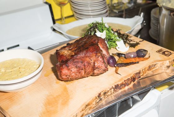 The pork was heated in a disposable, folded-in-half aluminum pan.