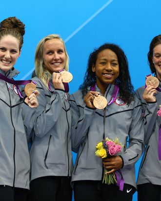 (L-R) Missy Franklin, Jessica Hardy, Lia Neal and Allison Schmitt of the United States celebrate with their bronze medal during the the Medal Cermony for the Women's 4x100m Freestyle Relay on Day One of the London 2012 Olympic Games at the Aquatics Centre on July 28, 2012 in London, England.
