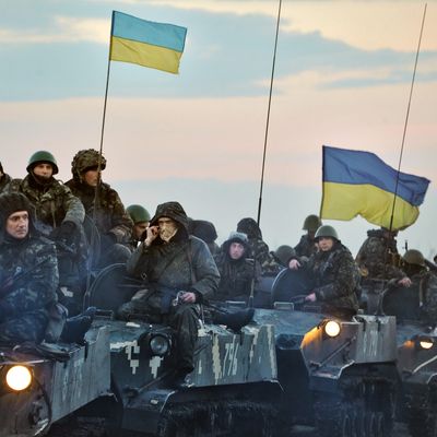 Ukrainian troops ride tanks on the way toward Slovyanks on April 14, 2014 in Ukraine. Tension has been rising in Ukraine, with pro-Russian activists occupying buildings in more eastern towns and a Russian fighter jet making passes over a U.S. warship in the Black Sea. 