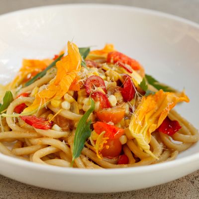 Bruno Pizza's bucatini pasta with fresh corn, squash blossoms, and spring onions.