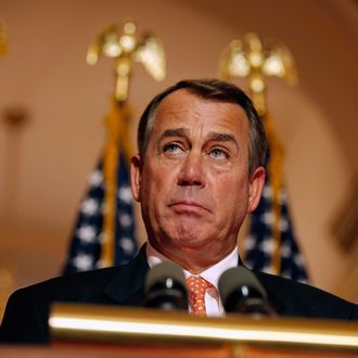 Speaker of the House U.S. Rep. John Boehner (R-OH) answers reporters' questions during a brief news conference on the payroll tax vote outside his office at the U.S. Capitol December 19, 2011 in Washington, DC.