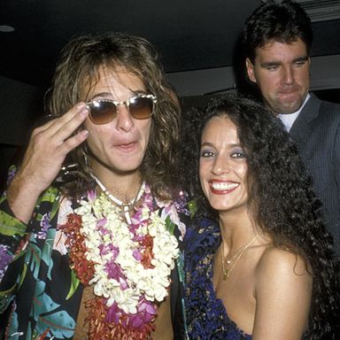 At the outset and height of his solo career, Diamond David Lee Roth, pictured here with actress Sonia Braga and about 250 leis, uses his powers of mental telepathy to mimic the photobomber behind them.