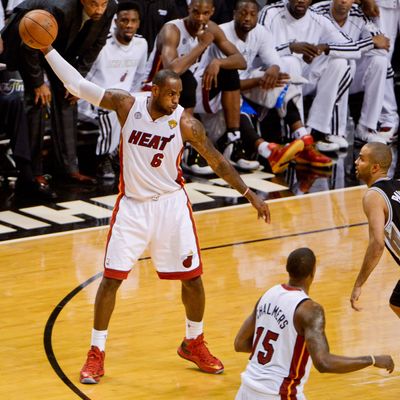 LeBron James #6 of the Miami Heat controls the ball against Tony Parker #9 of the San Antonio Spurs during Game Six of the 2013 NBA Finals on June 18, 2013 at American Airlines Arena in Miami, Florida. 