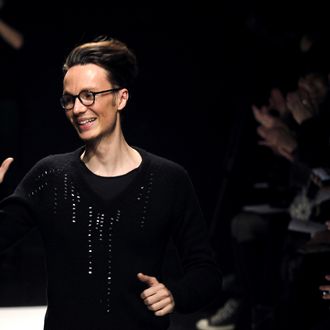 French designer Maxime Simoens acknowledges the crowd at the end of his Spring/Summer 2012 Haute Couture collection show, on January 25, 2012 in Paris.