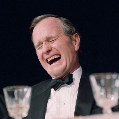 U.S. President George H. Bush laughs historically during comedian Jim Morris' performance at the White House Correspondents annual dinner in Washington, Saturday night, April 29, 1989. (AP Photo/J. Scott Applewhite)