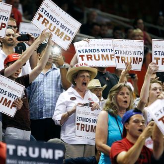 Supporters for Republican presidential candidate Donald Trump cheer as Trump arrives at a campaign rally on June 18, 2016 in Phoenix, Arizona. 