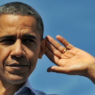 US President Barack Obama gestures as he listens to the public while speaking at the Asheville Regional Airport in Fletcher, North Carolina, on October 17, 2011 during the first day of his three-day American Jobs Act bus tour to discuss jobs and the economy. Obama's tour comes as Republicans and several moderate Democrats remain roadblocks to passing his $447 billion jobs plan in the Senate. AFP Photo/Jewel Samad (Photo credit should read JEWEL SAMAD/AFP/Getty Images)