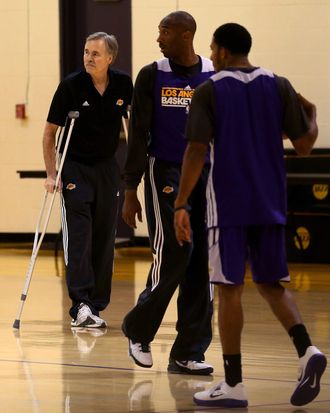 New Los Angeles Lakers head coach Mike D'Antoni (L) watches Kobe Bryant (C) and the rest of the Lakers during practice berfore a press conference introducing him as the new Los Angeles Lakers head coach on November 15. 2012 at the Lakers practice facility at the Toyota Sports Center in El Segundo, California.