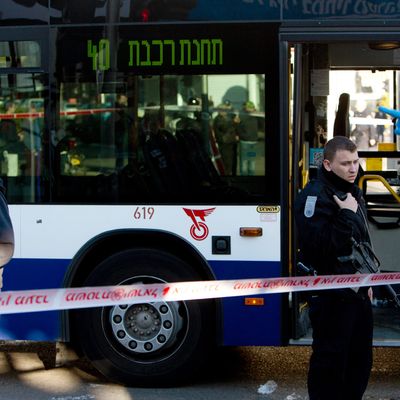 Israeli police officers secure the scene of a stabbing attack in Tel Aviv, Israel, Wednesday, Jan. 21, 2015.