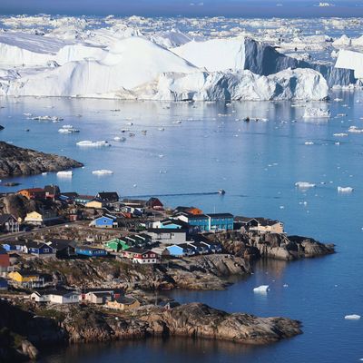 The village of Ilulissat is seen near the icebergs that broke off from the Jakobshavn Glacier on July 24, 2013 in Ilulissat, Greenland. 