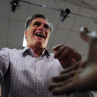 Republican presidential hopeful Mitt Romney greets supporters as he holds a campaign rally at Emma Lou Olson Civic Center in Pompano Beach, Florida, January 29, 2012. Florida will hold its Republican primary on January 31, 2012. AFP PHOTO/Emmanuel Dunand (Photo credit should read EMMANUEL DUNAND/AFP/Getty Images)