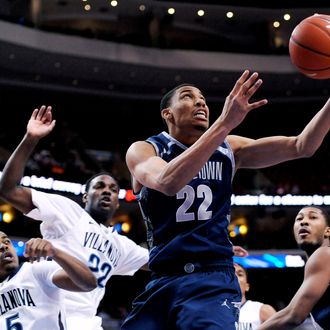 Georgetown's Otto Porter Jr. (22) drives past Villanova's Tony Chennault (5) and JayVaughn Pinkston (22) during the first half of an NCAA college basketball game, Wednesday, March 6, 2013, in Philadelphia. 