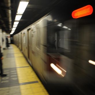 Commuters wait on a platform as a train arrives at a subway station in New York, November 21, 2008. The New York Metropolitan Transportation Authorithy (MTA) said that to plug a 1.2 billion USD budget gap next year, it must increase fare and toll revenues by 23 percent, which would raise an additional 670 USD million if the increase goes into effect in early June.