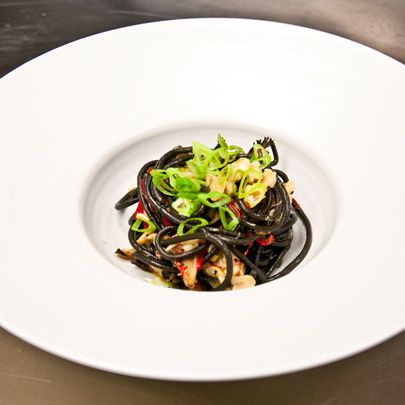 Bucatini with black garlic, snow crab, maitake, and chilies.