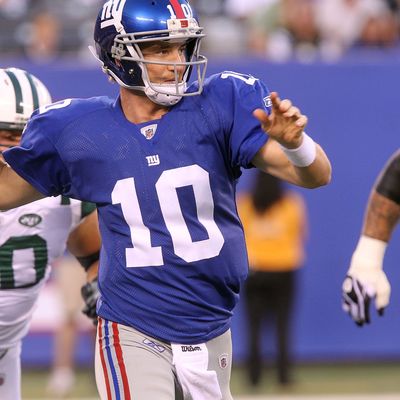 Quarterback Eli Manning #10 of the New York Giants passes the ball against the New York Jets.