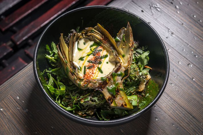 Wood-oven-roasted artichoke with lemon aioli, spring greens, and mint.