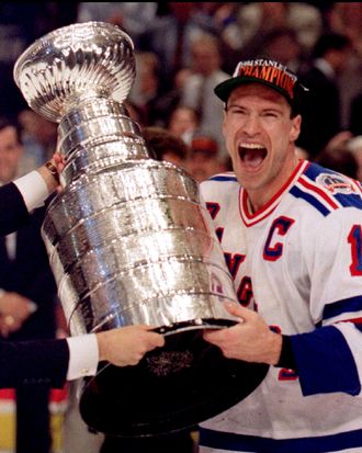 New York Rangers Mark Messier holds the Stanley Cup after winning the NHL championship in June 1994.