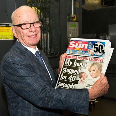 BROXBOURNE, UNITED KINGDOM - FEBRUARY 25: (EDITORS NOTE: THIS IMAGE IS FREE FOR USE UNTIL MARCH 3 2012) In this handout photograph provided by News International, Rupert Murdoch, Chairman and CEO of News Corporation, reviews the first edition of The Sun On Sunday as it comes off the presses on February 25, 2012 in Broxbourne, England. Around 3 million copies of 'The Sun On Sunday', the first ever Sunday edition of News Corporation's daily newspaper 'The Sun', are due to go on sale on Sunday February 26, 2012. (Photo by Arthur Edwards/News International via etty Images)