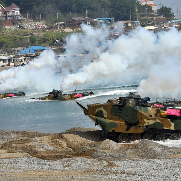 South Korean Marine amphibious assault vehicles land on the seashore during a joint landing operation by US and South Korean Marines in Pohang, 270 kms southeast of Seoul, on April 26, 2013. The US and South Korea staged a military landing exercise as the Korean peninsula was already engulfed in a cycle of escalating tensions triggered by the North Korea's nuclear test in February. AFP PHOTO / JUNG YEON-JE (Photo credit should read JUNG YEON-JE/AFP/Getty Images)