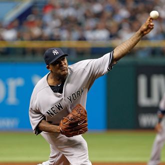 Pitcher CC Sabathia #52 of the New York Yankees pitches against the Tampa Bay Rays