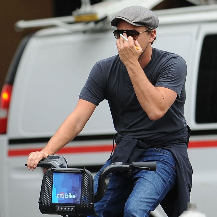 Leonardo DiCaprio Rides one the Blue Bikes from the Citi Bike Project in Soho.