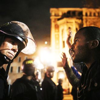 Protesters face off following a Staten Island, New York grand jury's decision not to indict a police officer in the chokehold death of Eric Garner on December 3, 2014 in Oakland, California. 
