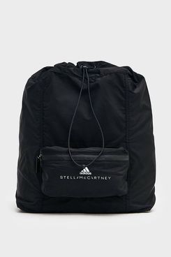 A minimalist black Adidas by Stella McCartney Drawstring Gymsack Backpack with a small front zip pouch emblazoned with both the Adidas and Stella McCartney logo. The Strategist - 48 Things on Sale You’ll Actually Want to Buy: From Sunday Riley to Patagonia