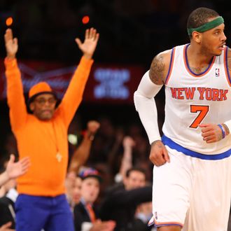 NEW YORK, NY - APRIL 09: Director Spike Lee celebrates a basket by Carmelo Anthony #7 of the New York Knicks during their game against the Washington Wizards at Madison Square Garden on April 9, 2013 in New York City. NOTE TO USER: User expressly acknowledges and agrees that, by downloading and or using this photograph, User is consenting to the terms and conditions of the Getty Images License Agreement. (Photo by Al Bello/Getty Images)