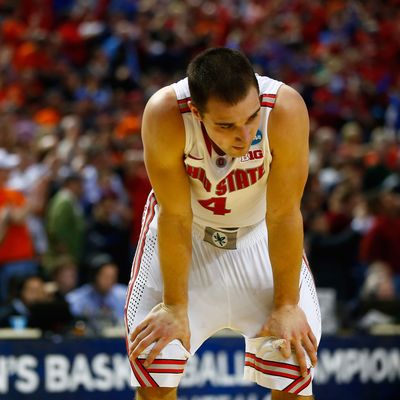Aaron Craft #4 of the Ohio State Buckeyes reacts after losing to the Dayton Flyers 60-59 in the second round of the 2014 NCAA Men's Basketball Tournament at the First Niagara Center on March 20, 2014 in Buffalo, New York. 