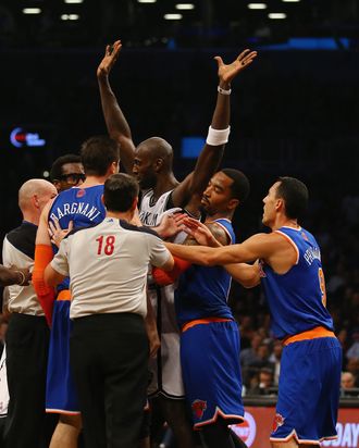 Andrea Bargnani #77 of the New York Knicks and Kevin Garnett #2 of the Brooklyn Nets are separated after an altercation during their game at the Barclays Center on December 5, 2013 in the Brooklyn borough of New York City. NOTE TO USER: User expressly acknowledges and agrees that, by downloading and or using this photograph, User is consenting to the terms and conditions of the Getty Images License Agreement.