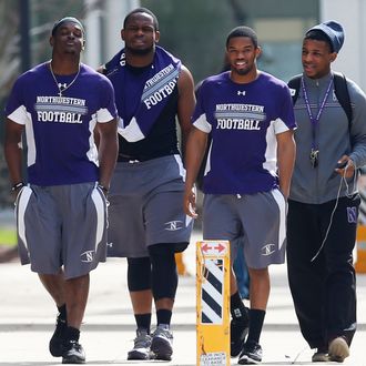 Northwestern University football players make their way to the building where voting is taking place to determine if student athletes want to join a union in Evanston, Illinois