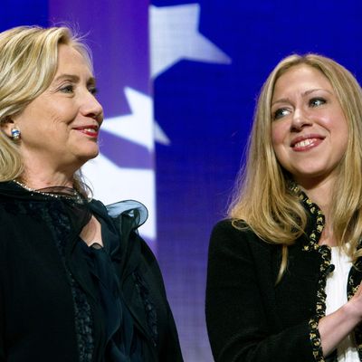 NEW YORK CITY- SEPTEMBER 22: Hillary Rodham Clinton (L), Secretary of State, stands as she is applauded by her daughter Chelsea Clinton during the closing Plenary session of the seventh Annual Meeting of the Clinton Global Initiative (CGI) at the Sheraton New York Hotel on September 22, 2011 in New York City. Established in 2005, by former US President Bill Clinton, the Clinton Global Initiative (CGI) convenes global leaders to devise and implement innovative solutions to some of the world‚??s most pressing challenges. (Photo by Daniel Berehulak/Getty Images)