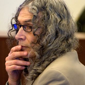 Serial murder suspect Rodney Alcala listens to Orange County deputy district attorney, Matt Murphy's final arguments during closing arguments in Santa Ana, Calif., Monday, Feb. 22, 2010. 