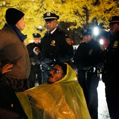 NEW YORK, NY - NOVEMBER 16: An Occupy Wall Street protester confronts the NYPD when they enforce a no sleeping rule in Zuccotti Park on November 16, 2011 in New York City. Police had removed the protesters from the park early in the morning. A judge ruled that protesters are allowed back to the park but won't be allowed to camp there. Hundreds of protesters, who rallied against inequality in America, have slept in tents and under tarps since September 17 in Zuccotti Park, which has since become the epicenter of the global Occupy movement. The raid in New York City follows recent similar moves in Oakland, California, and Portland, Oregon (Photo by Allison Joyce/Getty Images)