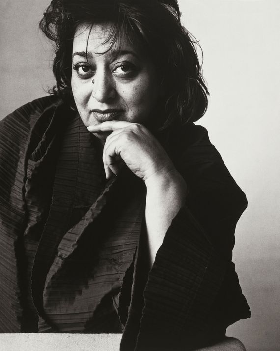 A black and white image of Zaha Hadid, an architect. 