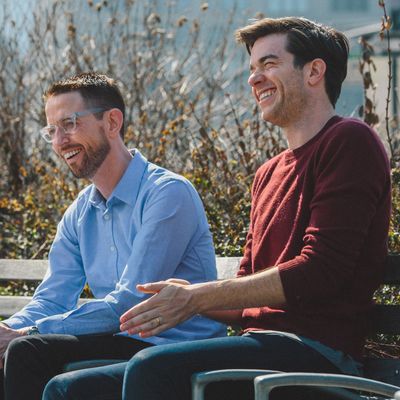 Comedians Neal Brennan, left, and John Mulaney, right, sit on a park bench in Tribeca on March 9th, 2016. Brennan is currently doing a solo show called 