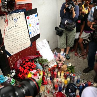 NEW YORK, NY - JULY 19: A memorial to
Eric Garner is viewed following a demonstration against his death after he was taken into police custody in Staten Island on Thursday on July 19, 2014 in New York City. New York Mayor Bill de Blasio announced in a news conference yesterday that there will be a full investigation into the circumstances surrounding the death of Garner. The 400-pound, 6-foot-4 asthmatic, Garner (43) died after police put him in a chokehold outside of a convenience store for illegally selling cigarettes. (Photo by Spencer Platt/Getty Images)