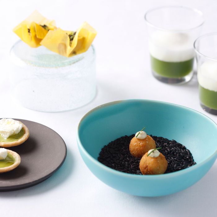 Chef John Fraser's refined canapes, including truffled arancini and a pea-and-pineapple shot.