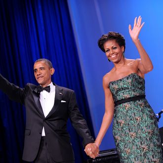 WASHINGTON, DC - SEPTEMBER 14: (AFP-OUT) U.S. President Barack Obama (L) and First Lady Michelle Obama wave during the Congressional Hispanic Caucus Institute's 34th Annual Awards Gala at the Washington Convention Center on September 14, 2011 in Washington, DC. Obama spoke about the $447 billion package of tax cuts as well as public spending and new jobs plan. (Photo by Olivier Douliery-Pool/Getty Images)
