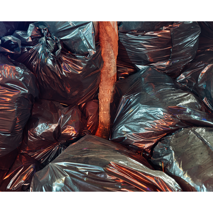 Black Trash Bags Along A Street And Sidewalk In Greenwich Village