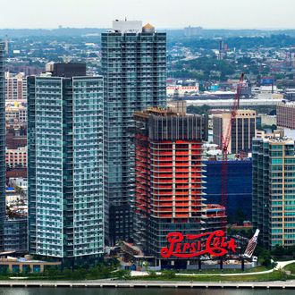 The Long Island City waterfront and the Pepsi-Cola sign are seen from the 34th floor at 50 UN Plaza in New York, U.S., on Thursday, July 11, 2013. Located across the street from the United Nations, 50 UN Plaza, Arthur and William Lie Zeckendorf's latest Manhattan luxury-condominium project is a 44-story tower that will be the Turtle Bay neighborhood's first new residential project in a dozen years. 